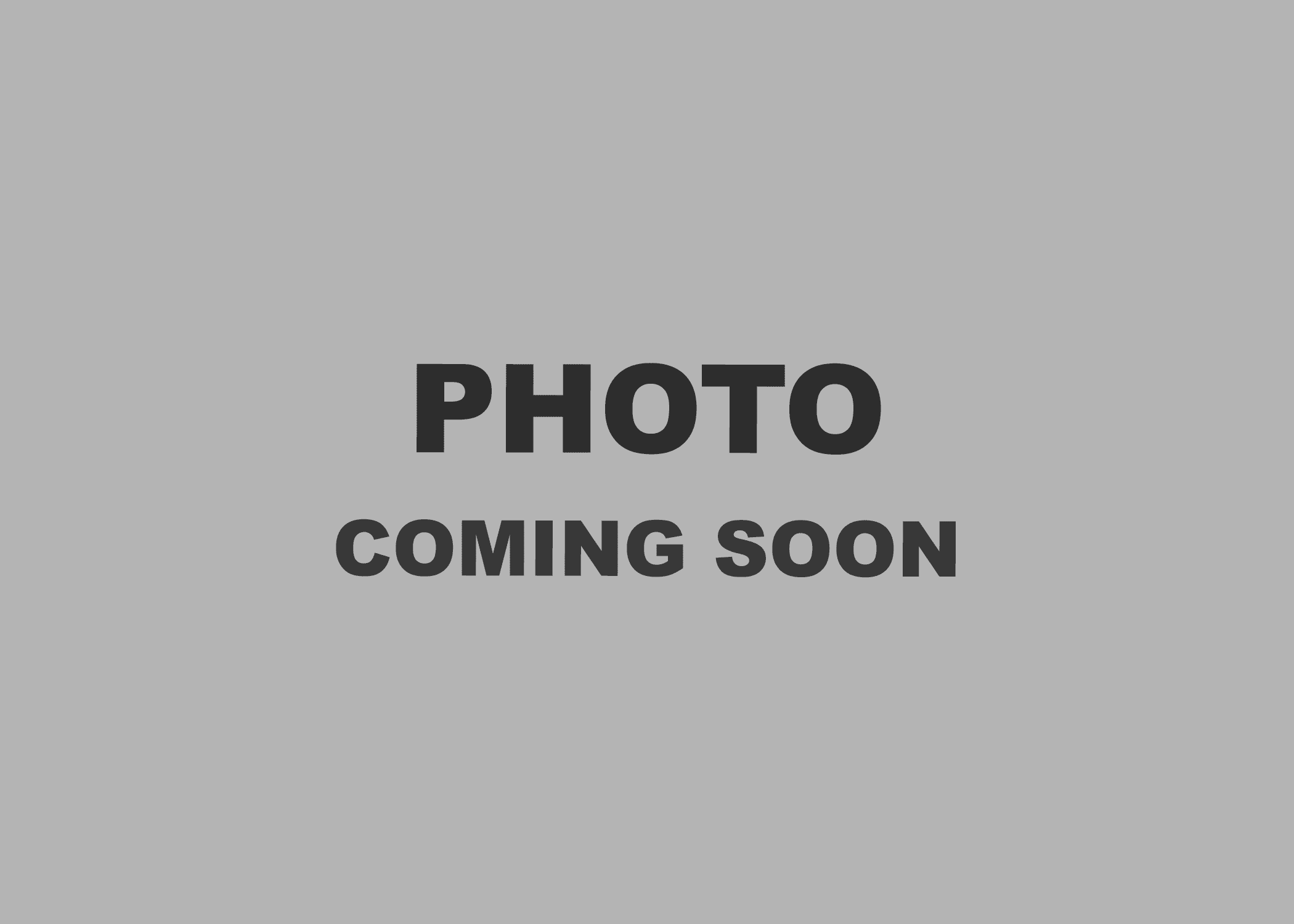 A grey background with bold black text reading "PHOTO COMING SOON" in the center.
